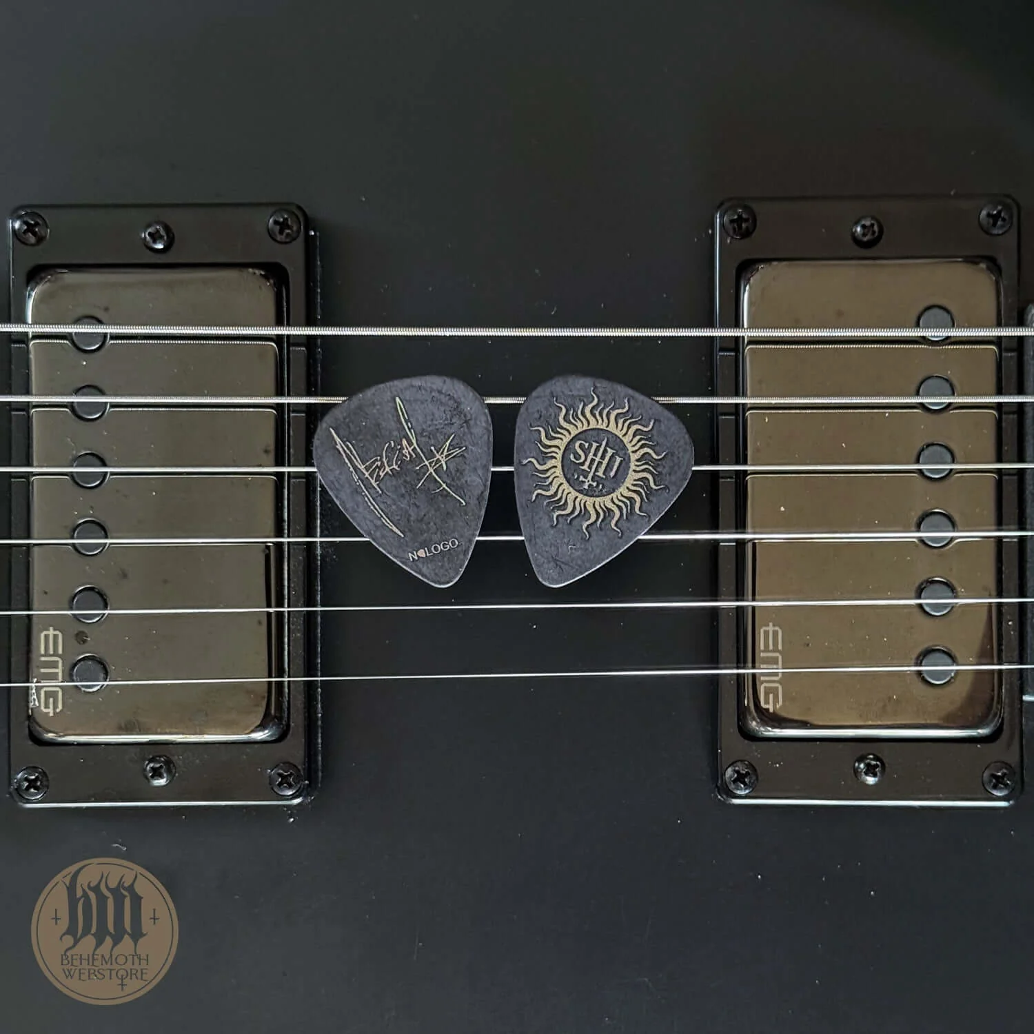 A plastic guitar pick Nergal signature 'TSOG'