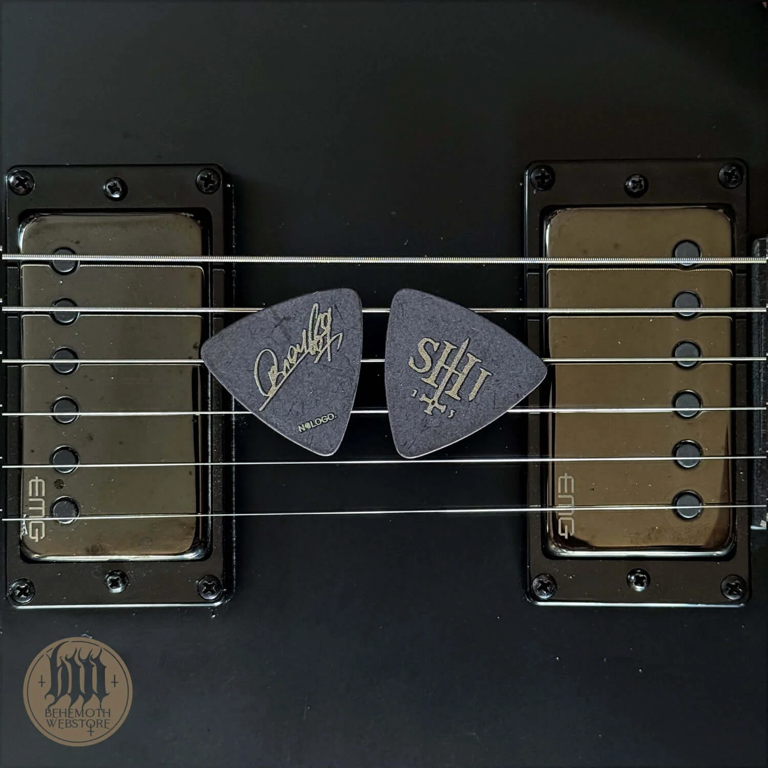 A plastic guitar pick Orion signature 'SHIT'